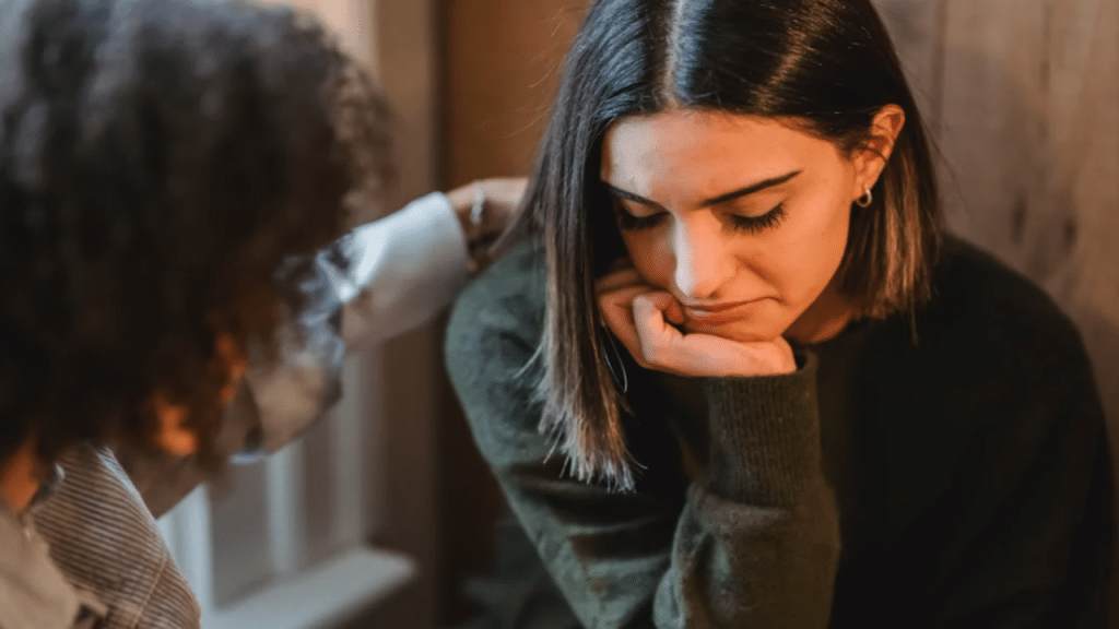 A woman comforting her crying friend