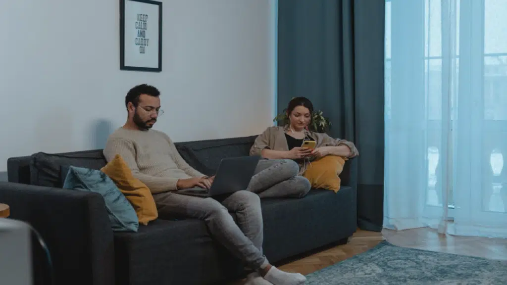 A couple ignoring each other at home