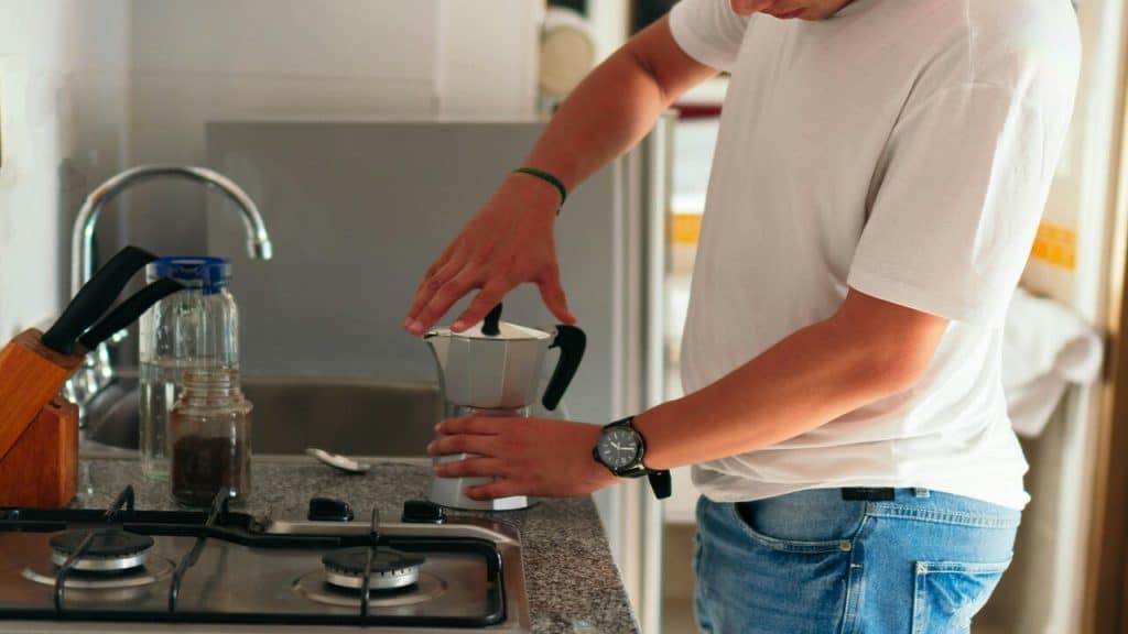 A man preparing coffee