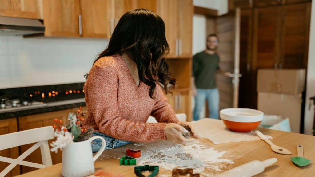 A couple talking in the kitchen