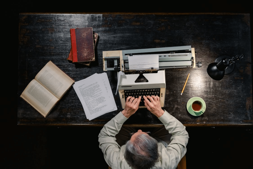 A Man Using a Typewriter