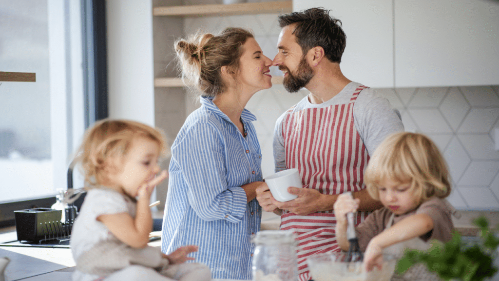 A couple kissing in the kitchen