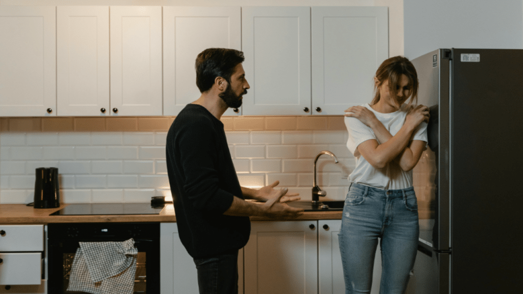 A couple having an argument in the kitchen