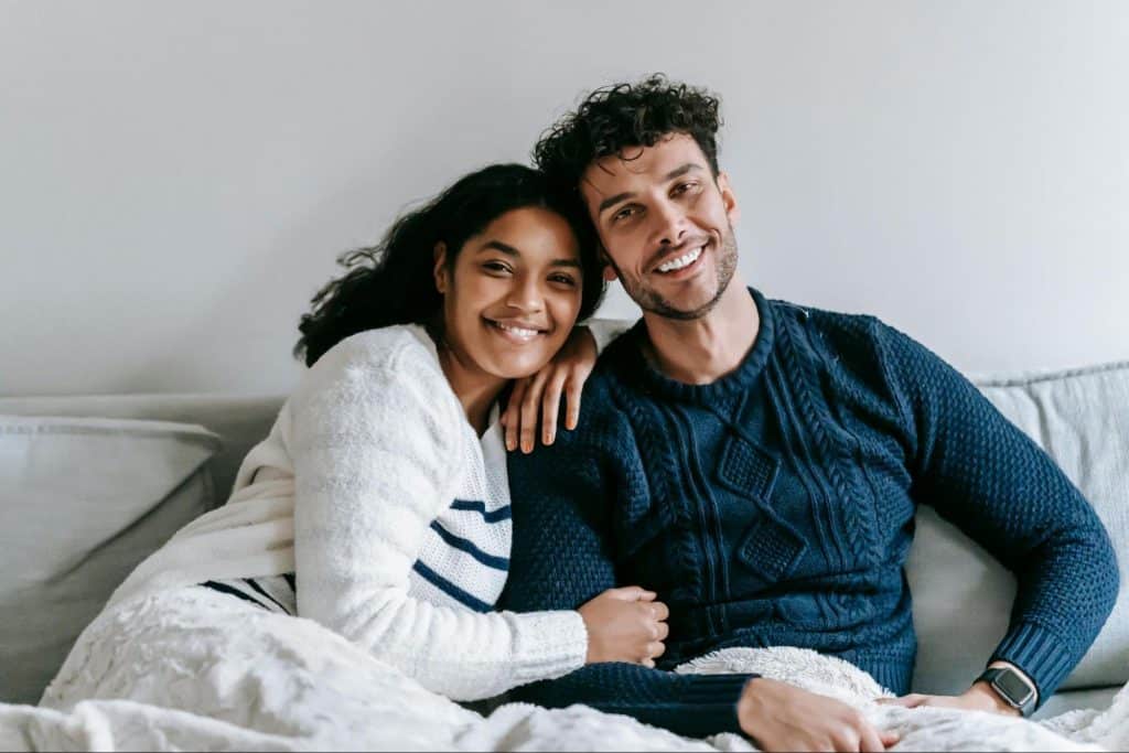 A man and woman smiling