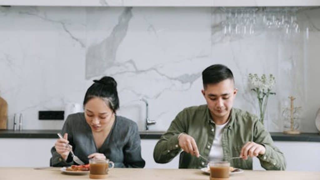 Couple eating dinner without speaking