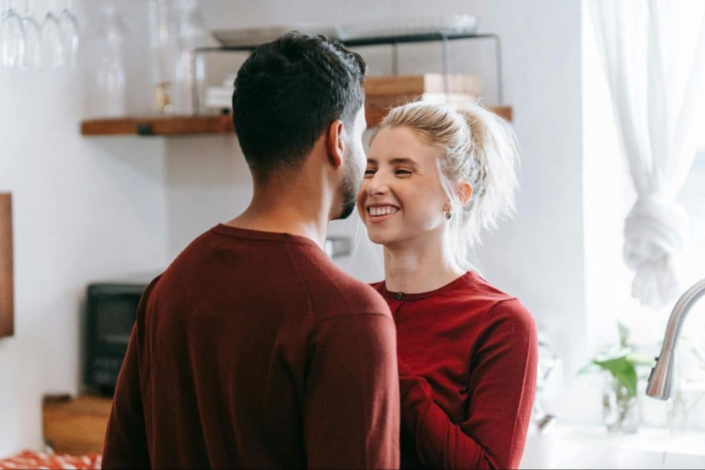 A man and woman facing each other