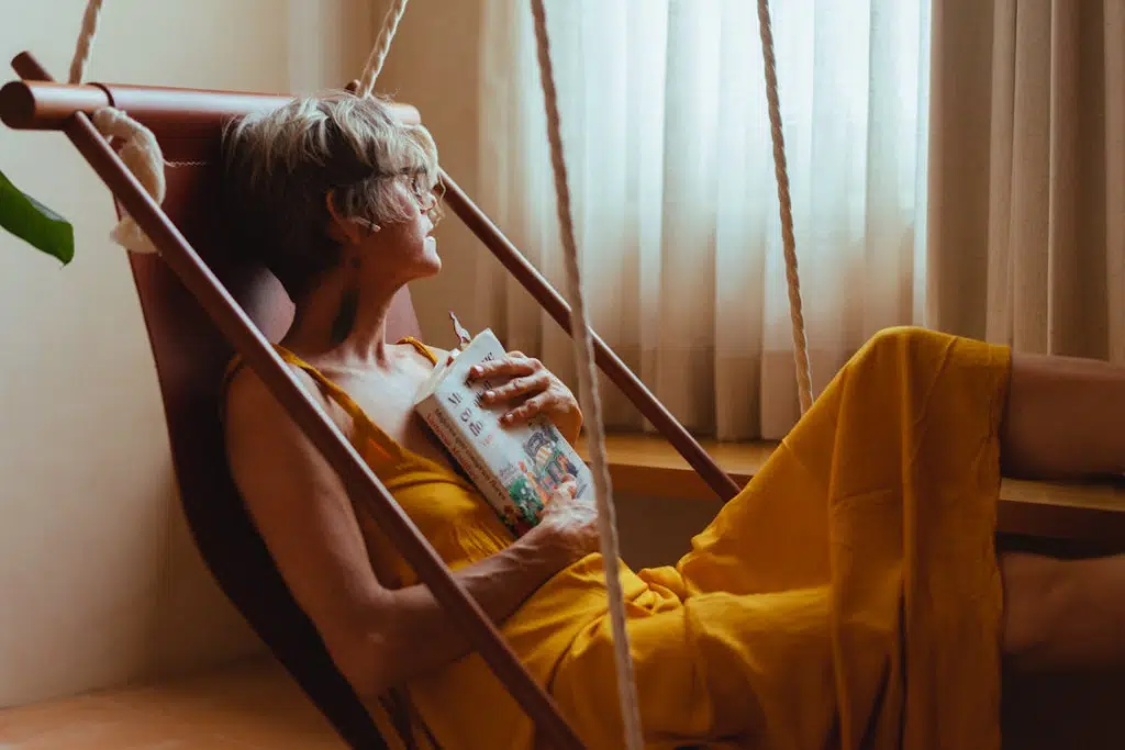 Woman Looking Pensive while Holding a Book