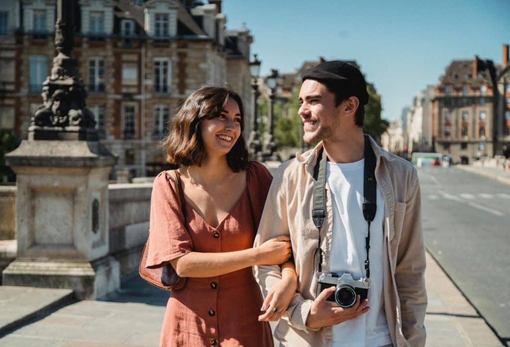 A man and woman walking outside