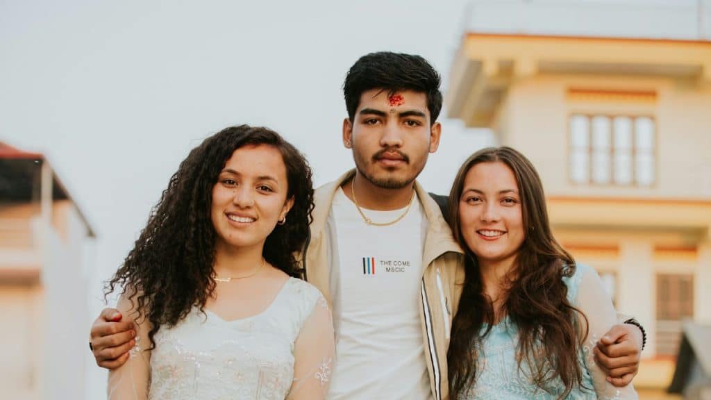 Three people posing for a photo.
