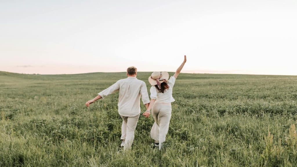 A couple walking on a field