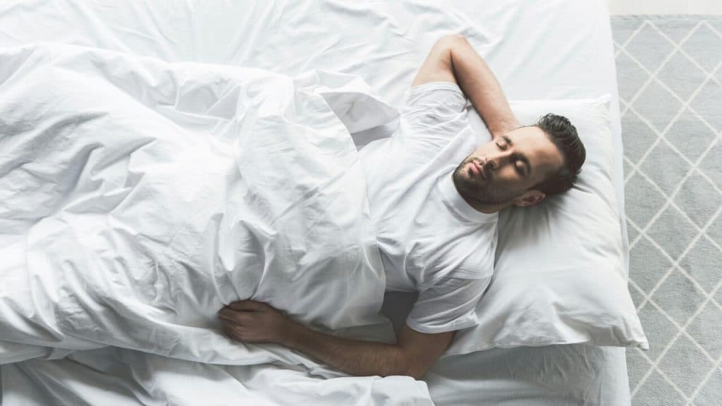 A man sleeping at home