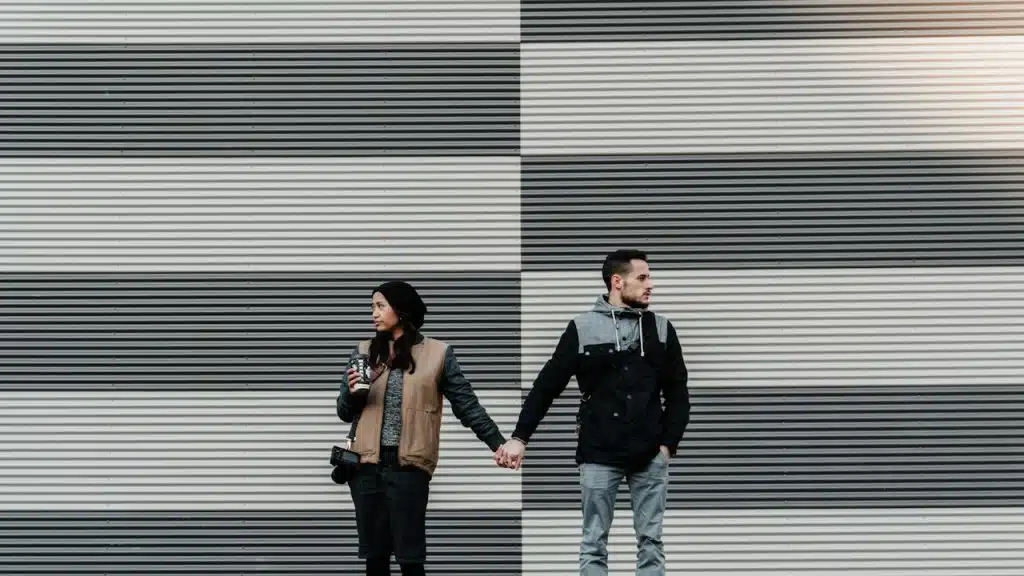 A man and a woman holding each other's hand.