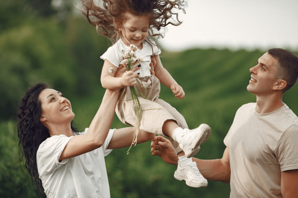 Mother Lifting up Her Daughter
