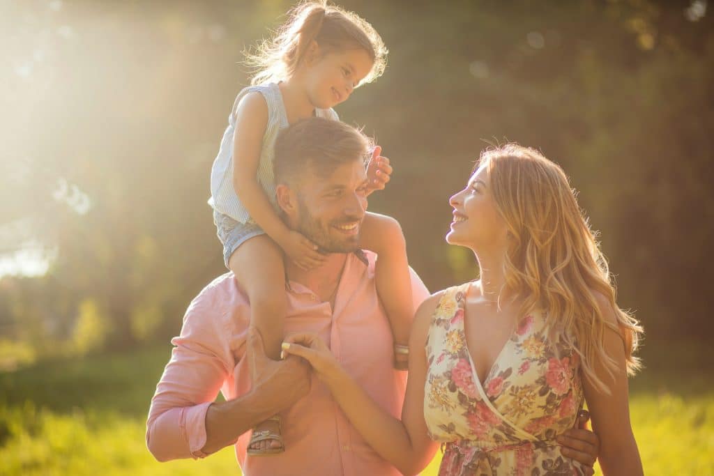The young family is spending their time outdoors.