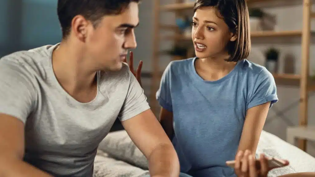 A young woman is passionately arguing with a man who looks away from her.