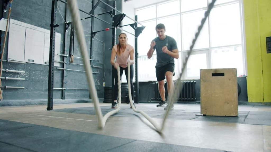 Couple exercising together at a gym