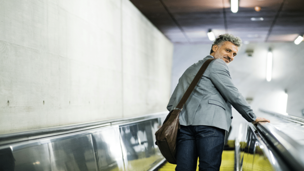 A man on an escalator