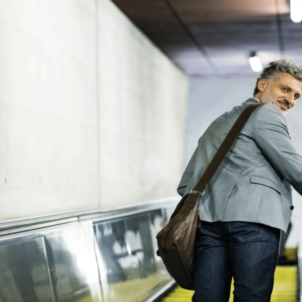 A man on an escalator