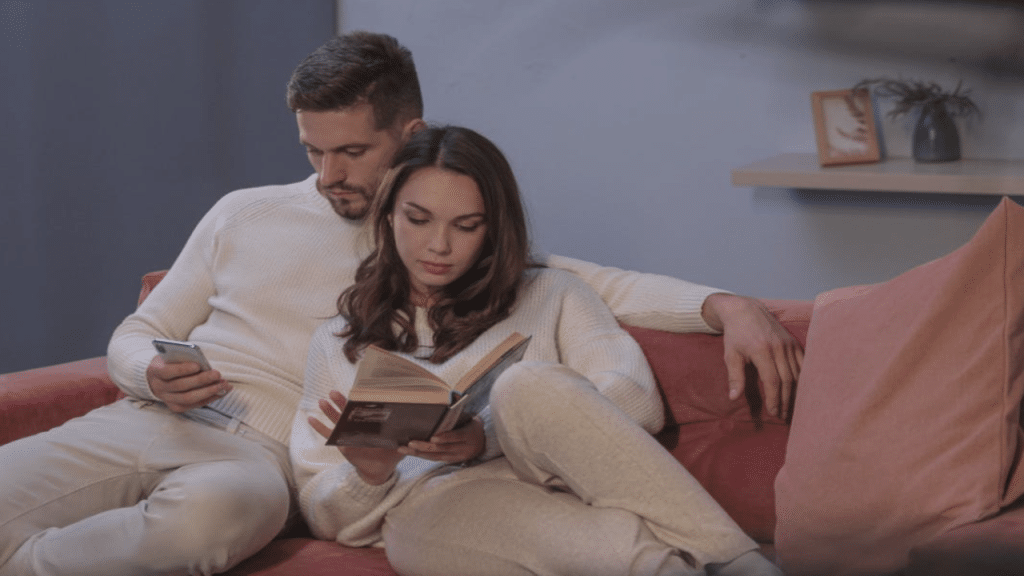 A couple ignoring each other at home