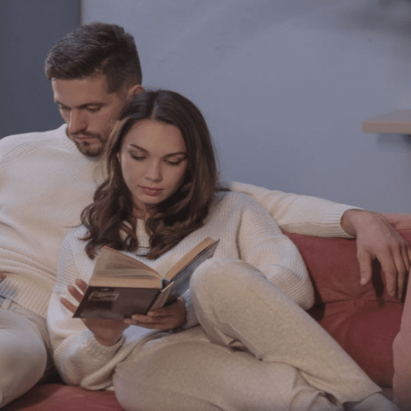 A couple ignoring each other at home