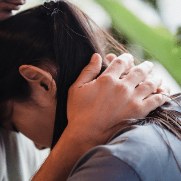 A couple hugging at home