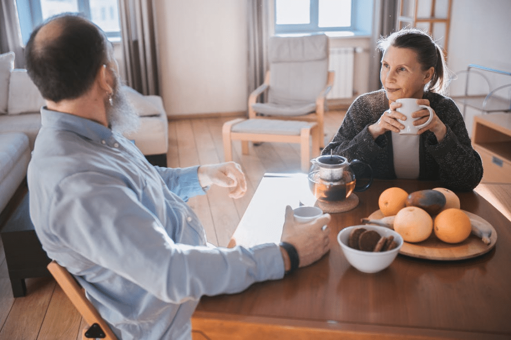 An Elderly Couple Couple Having a Cup of Tea Together