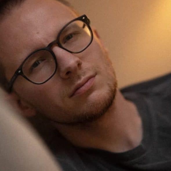 Man reflecting quietly and feeling sad about self improvement