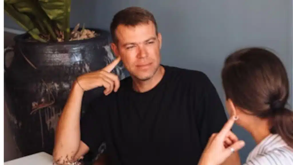 Man nodding and listening calmly during a discussion