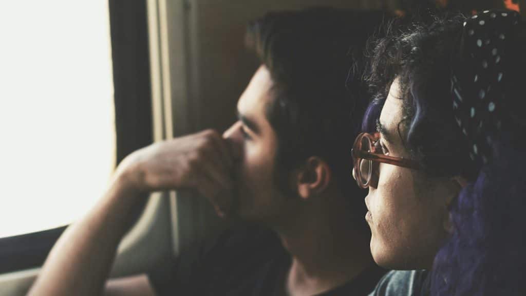 A couple looking out of a window.