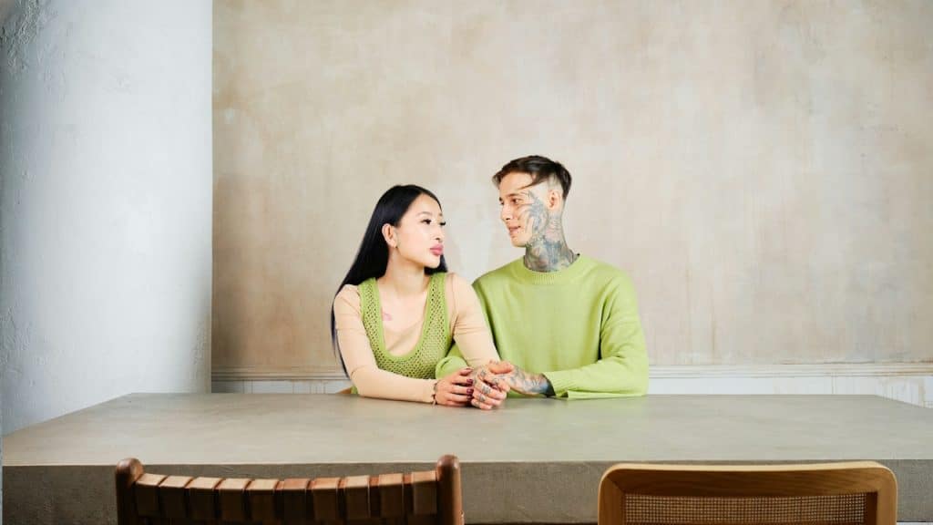 A man and a woman sitting at a table.