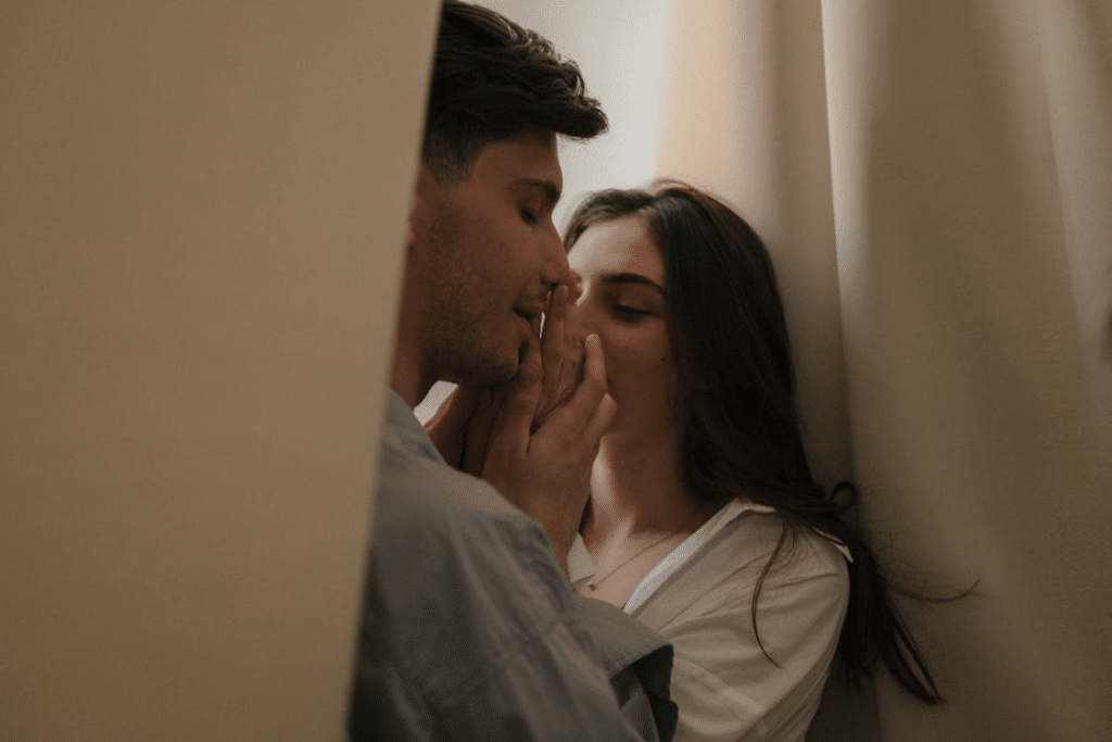 A Man and a Woman behind Drapes