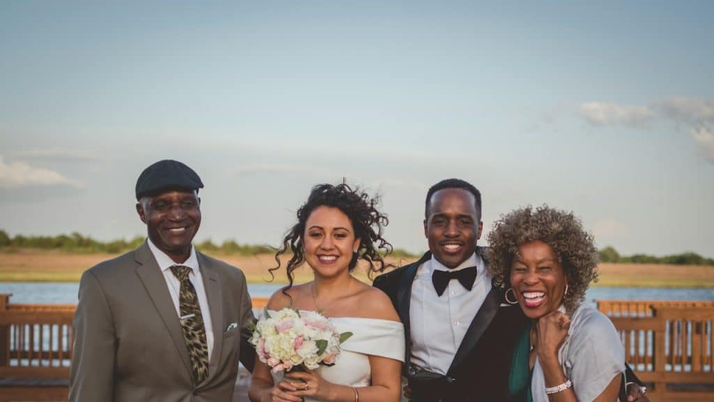 A wedding photo with the groom’s parents.