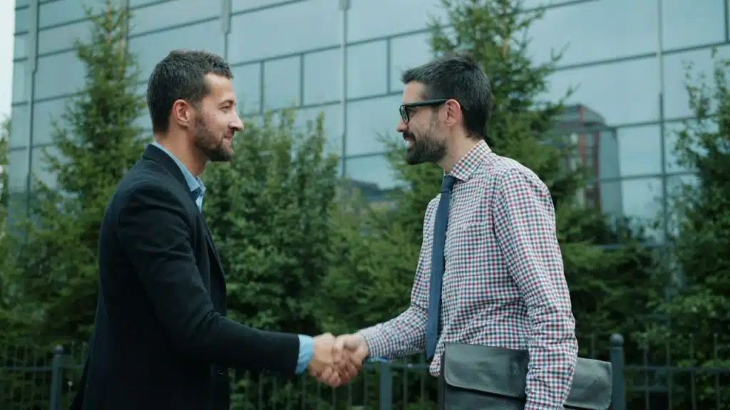 Two men shaking hands.