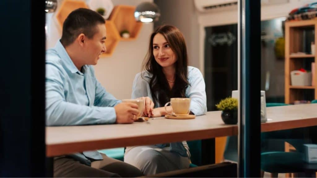 Couple sitting at a table having a calm conversation