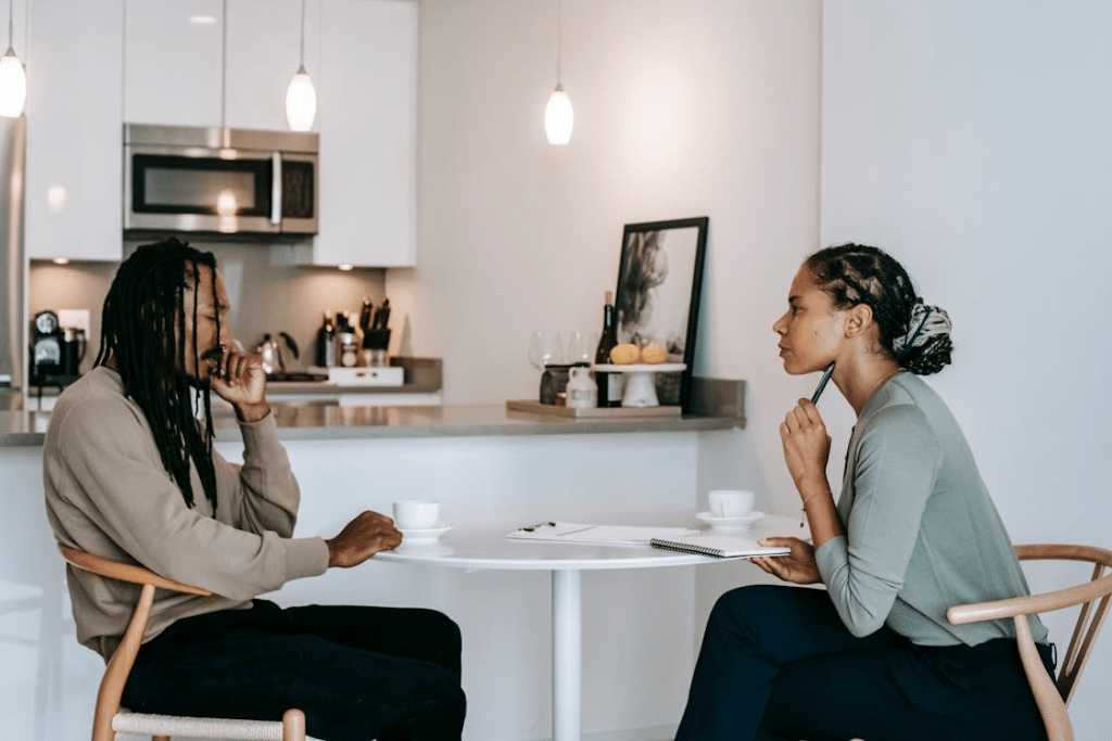Frustrated man sharing problems with a woman