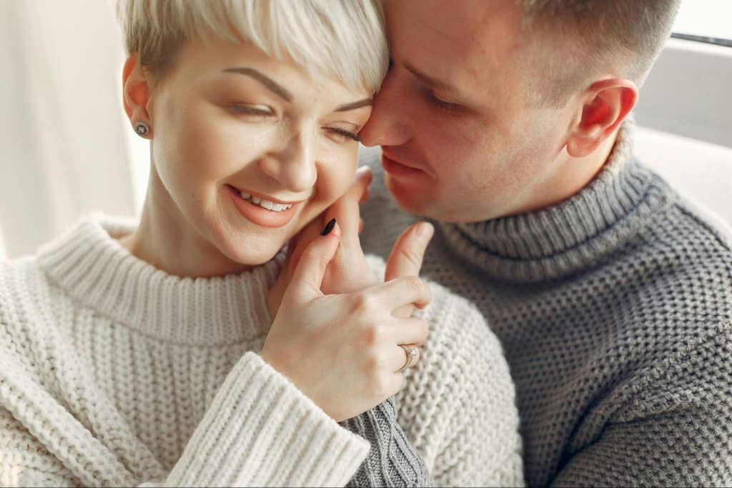A man hugging a woman