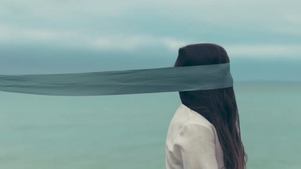 A woman with her eyes covered