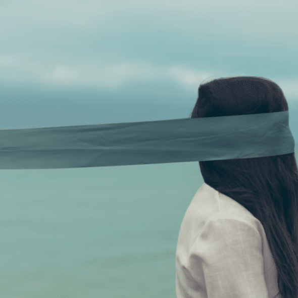 A woman with her eyes covered