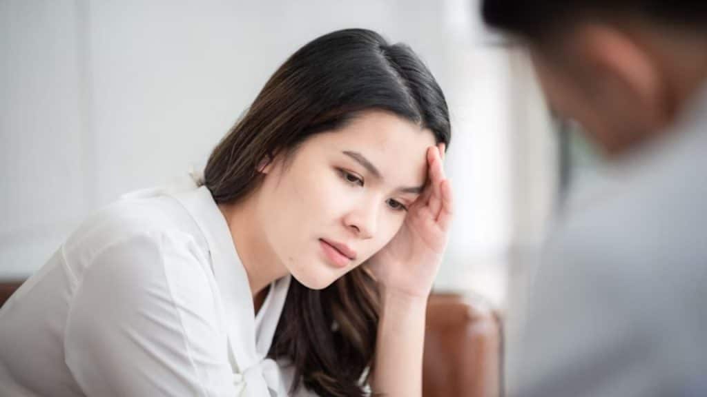 Woman staring down during an argument
