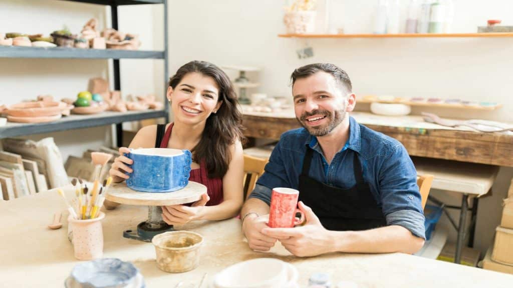 A couple doing pottery together