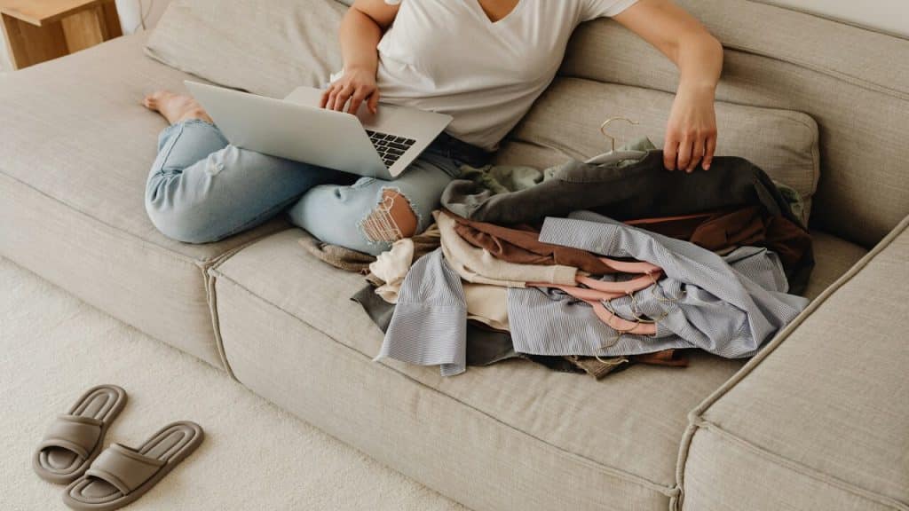 A woman working while doing the laundry