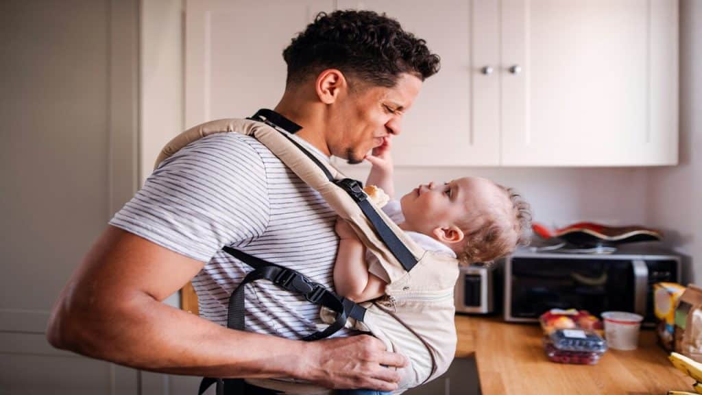 A man taking care of his baby