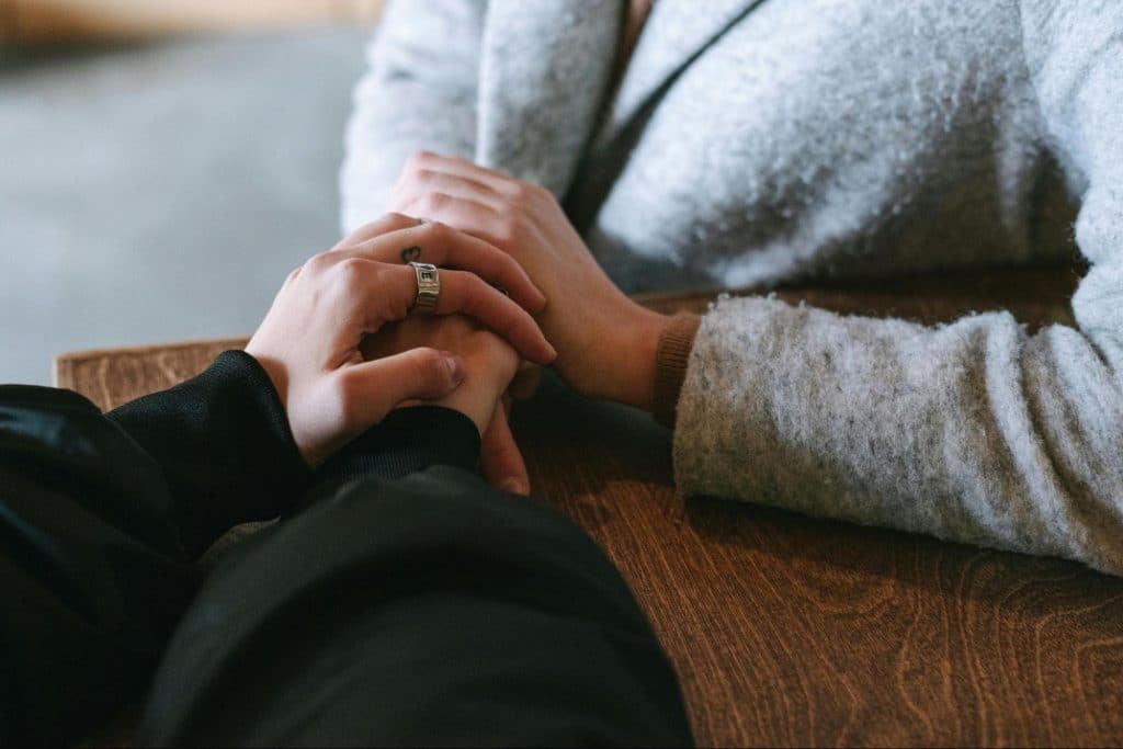 A man and woman holding hands