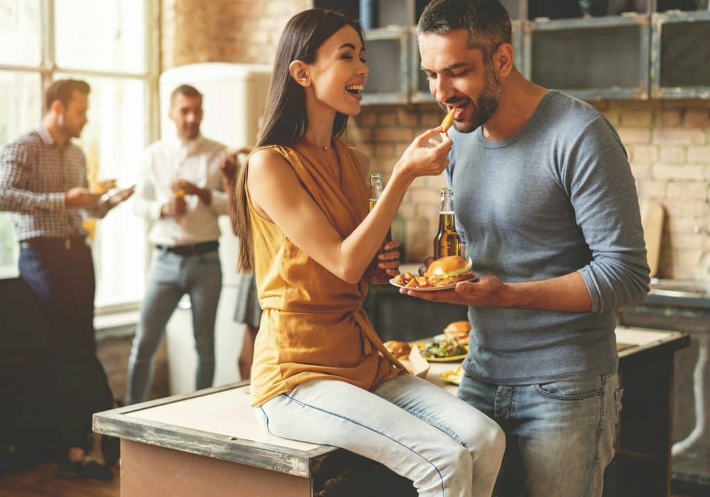 The couple is having fun at the party.