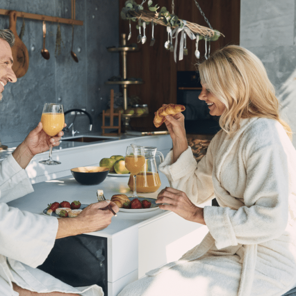 A mature couple enjoying breakfast together