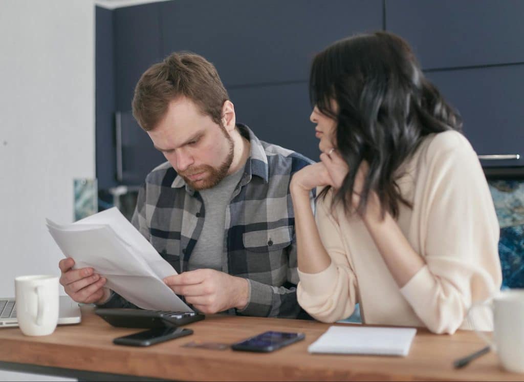 A man pressured and a woman looking at him