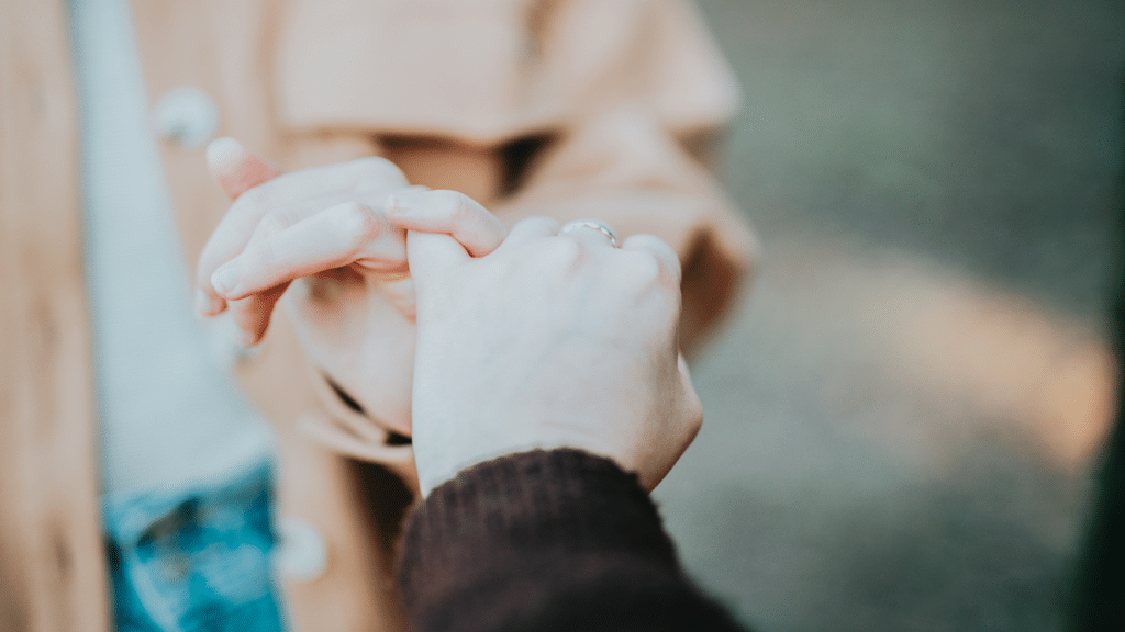A couple doing the pinky swear