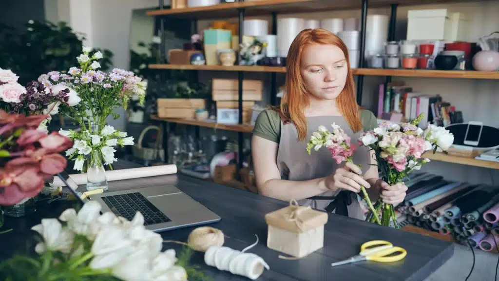 A woman arranging flowers