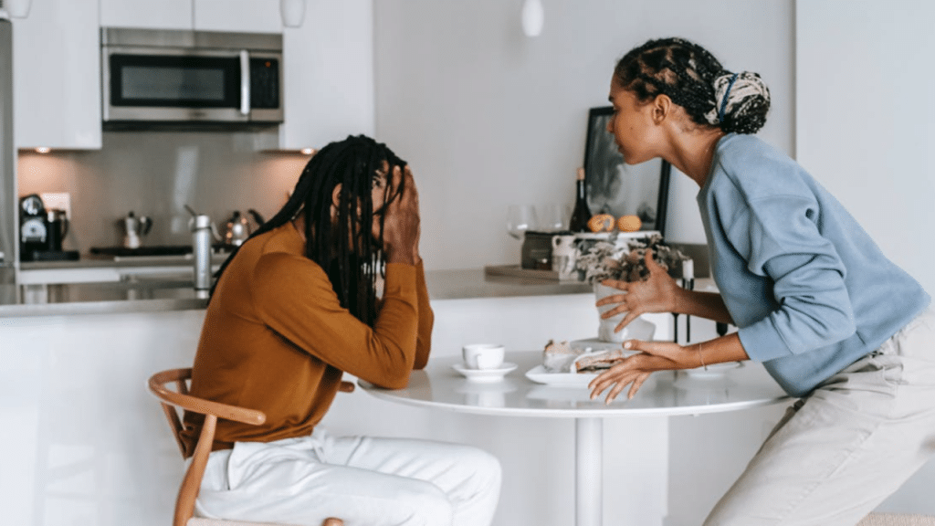 A couple fighting in the dining room