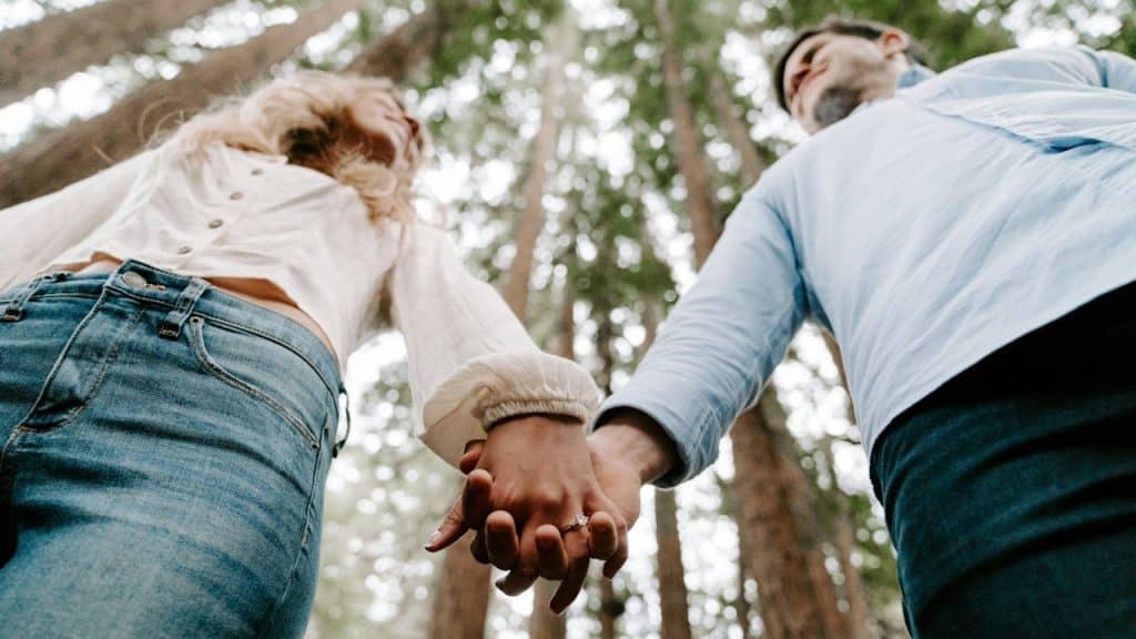 A couple holding hands.